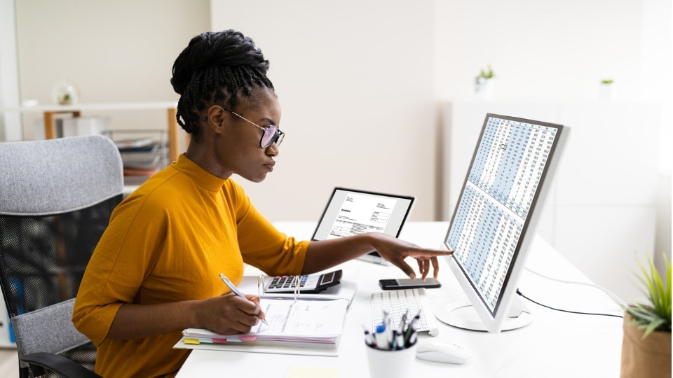 woman analyzing stats on computer