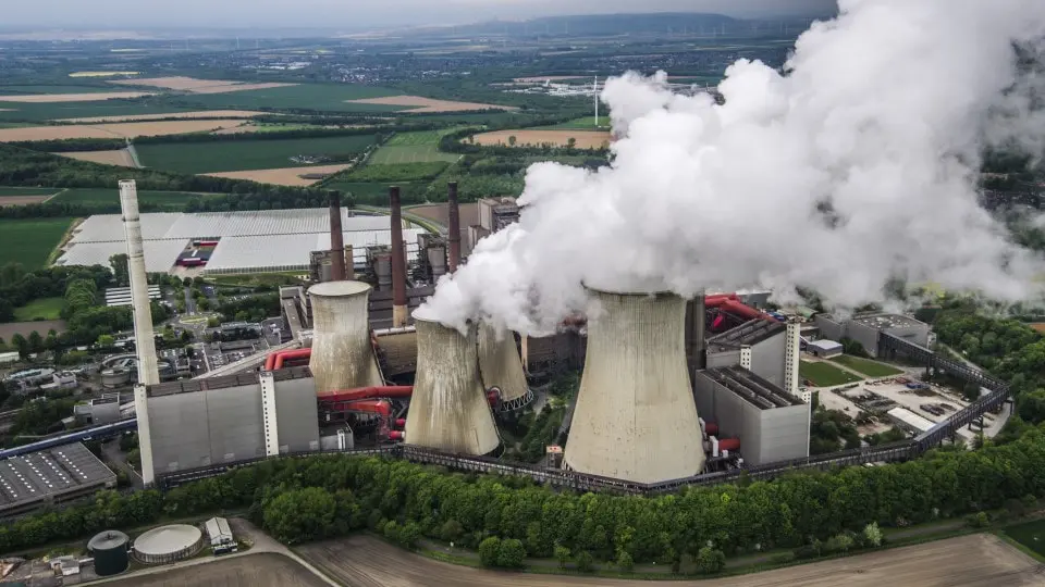 Aerial view of a factory in Germany wind turbines in the background