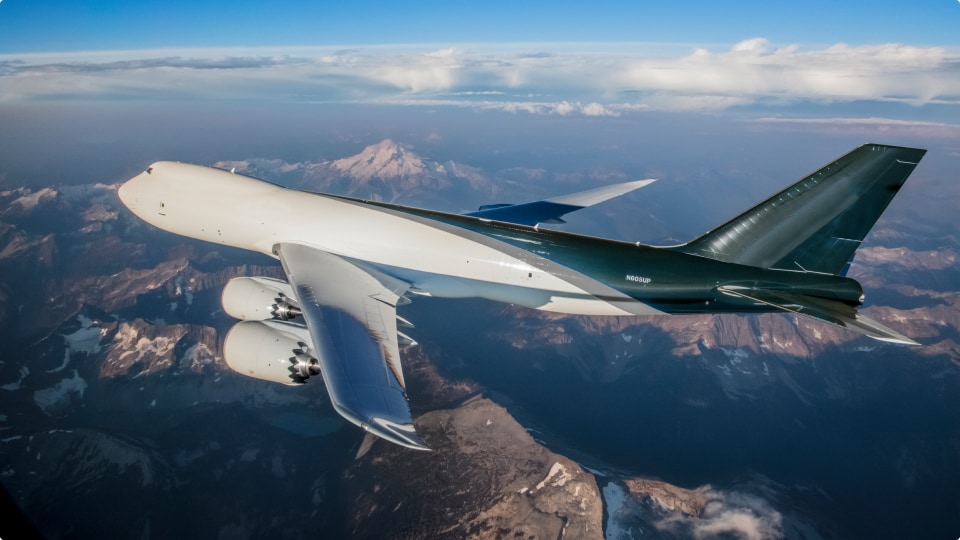 Airplane flying over the mountains