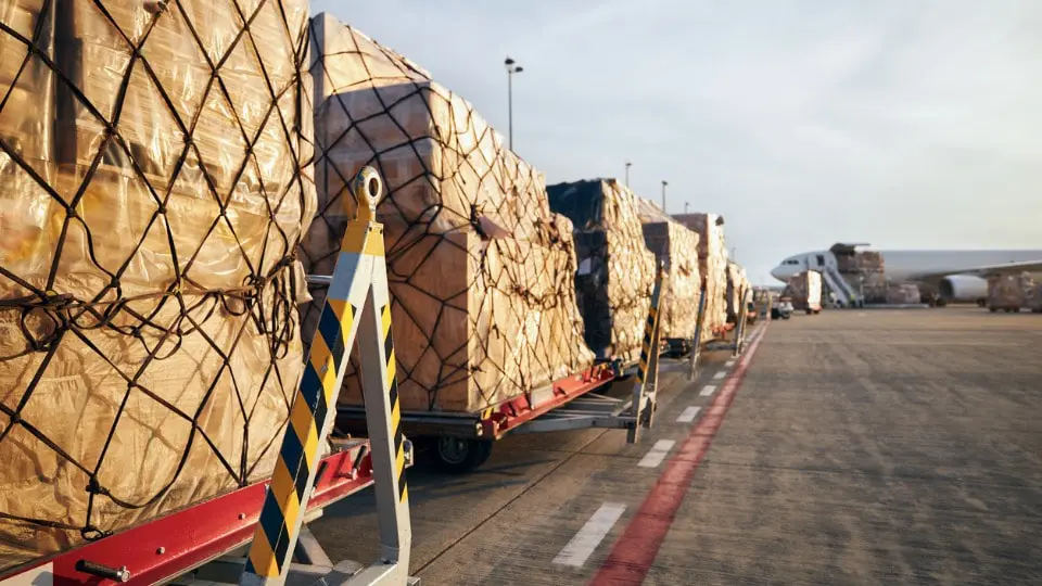 Loading of cargo containers to airplane at airport