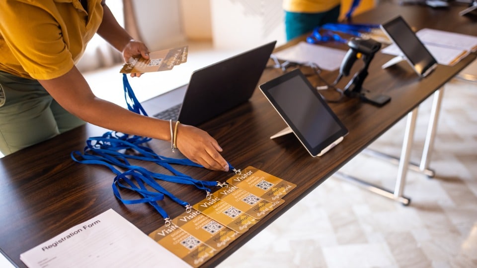 a person arranging business ID cards  before a business conference