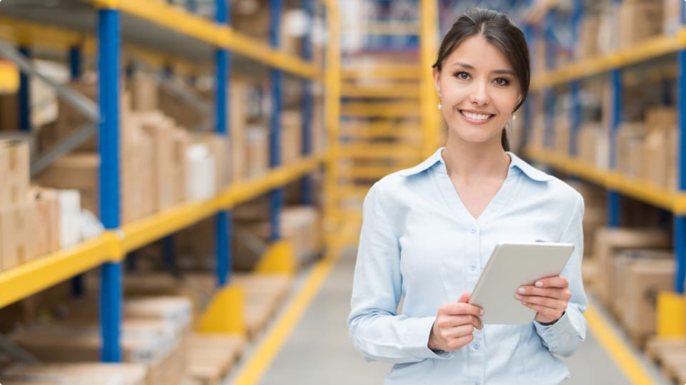 Woman in growing business UPS managing order entry using UPS integrated technology