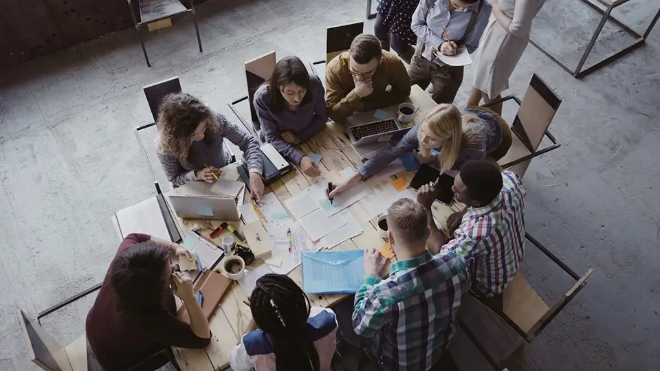 A business team sitting at a table and working